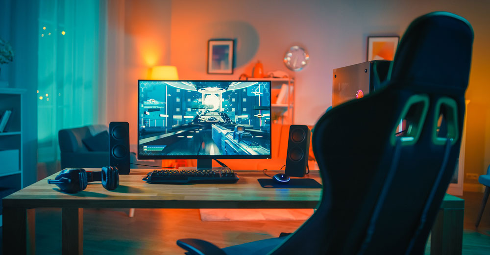 Powerful Personal Computer Gamer Rig with First-Person Shooter Game on Screen.